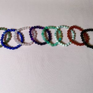 Natural beaded gemstone bracelet featuring assorted polished crystal beads in earthy tones, handcrafted stretch jewelry for elegant everyday wear.