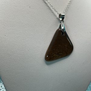 Black Tiger’s Eye necklace featuring a polished golden-brown gemstone pendant with natural chatoyancy, elegant crystal jewelry on a delicate chain.