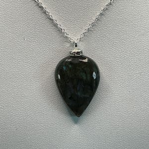 Black Obsidian necklace featuring a smooth polished deep black volcanic stone pendant on a delicate chain, elegant natural gemstone jewelry piece.