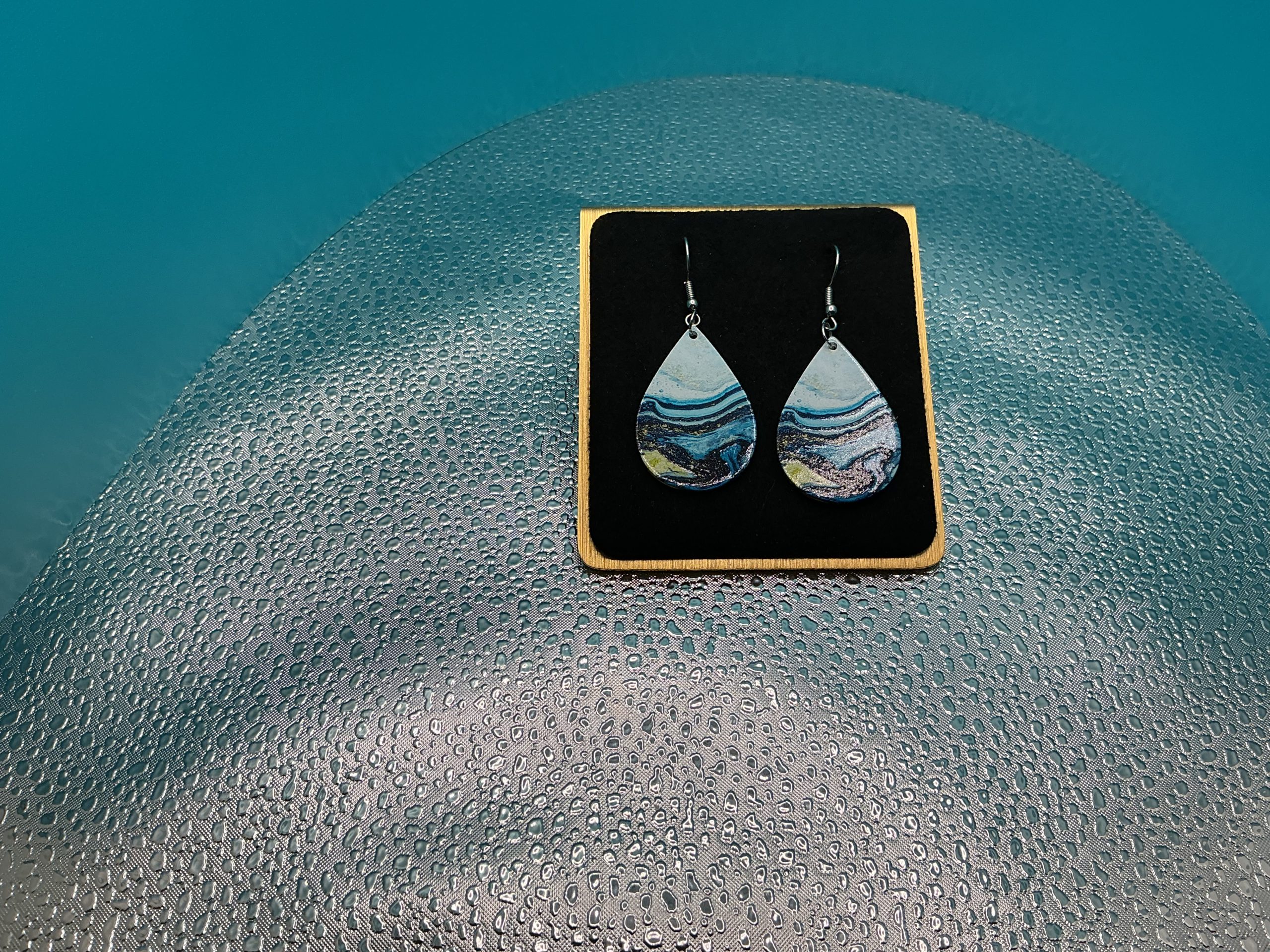 Stylish blue acrylic earrings with unique pattern design