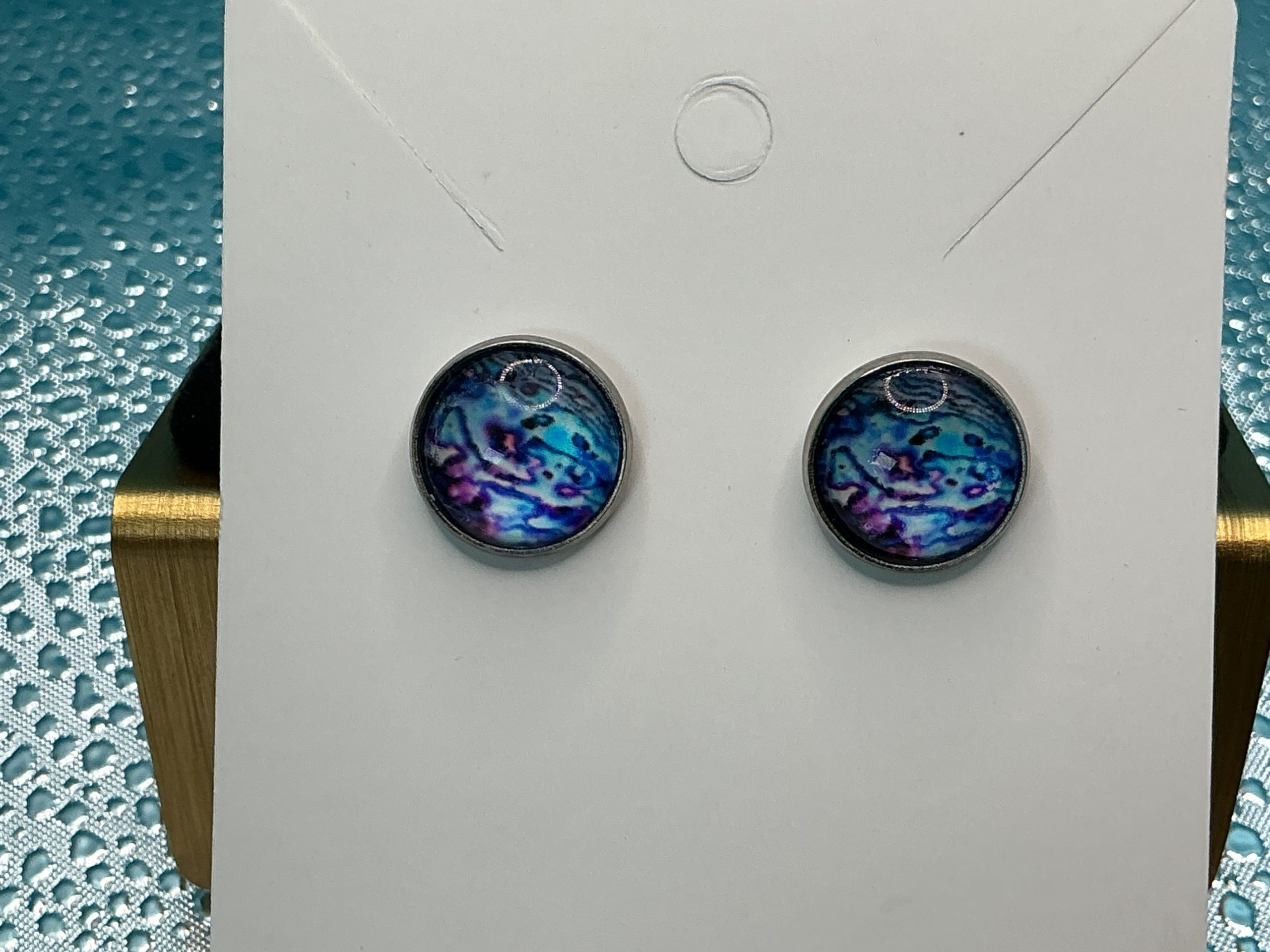 Blue pattern stud earrings featuring unique natural stone design with blue tones in a minimal polished setting