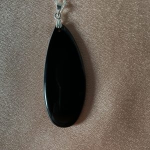 Affordable Black Obsidian necklace with polished deep black stone pendant on a delicate chain, natural gemstone jewelry for everyday wear and gifting.