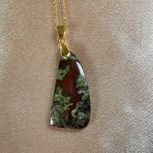 Bloodstone pendant necklace featuring natural green gemstone with red flecks in a teardrop design